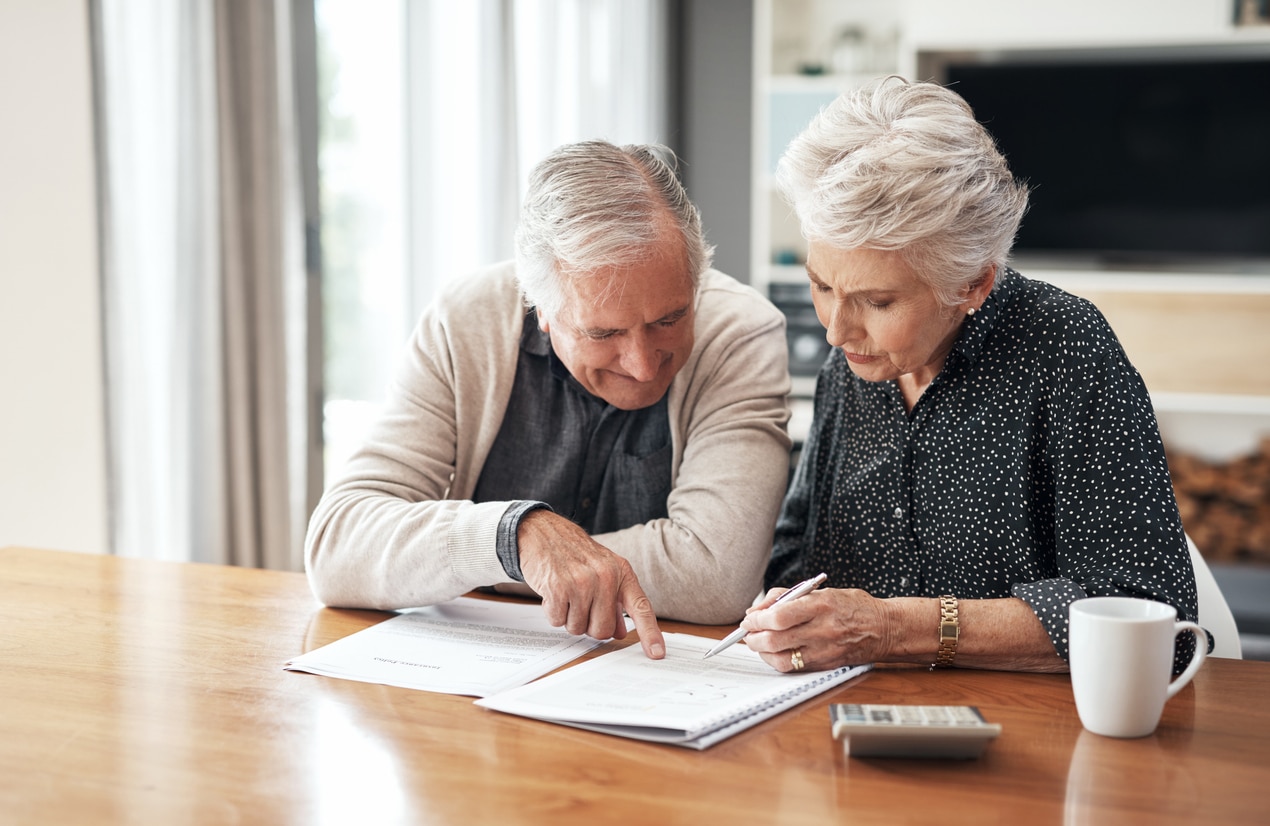 older couple discussing finances and tax deductions for assisted living