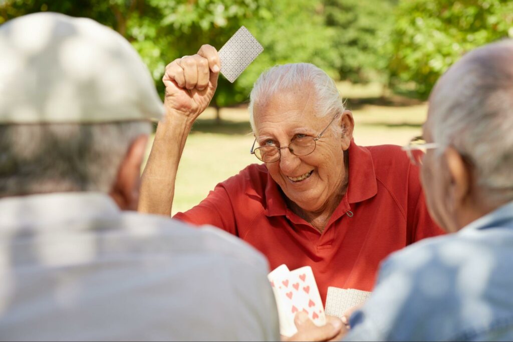 senior-men-playing-cards-outside