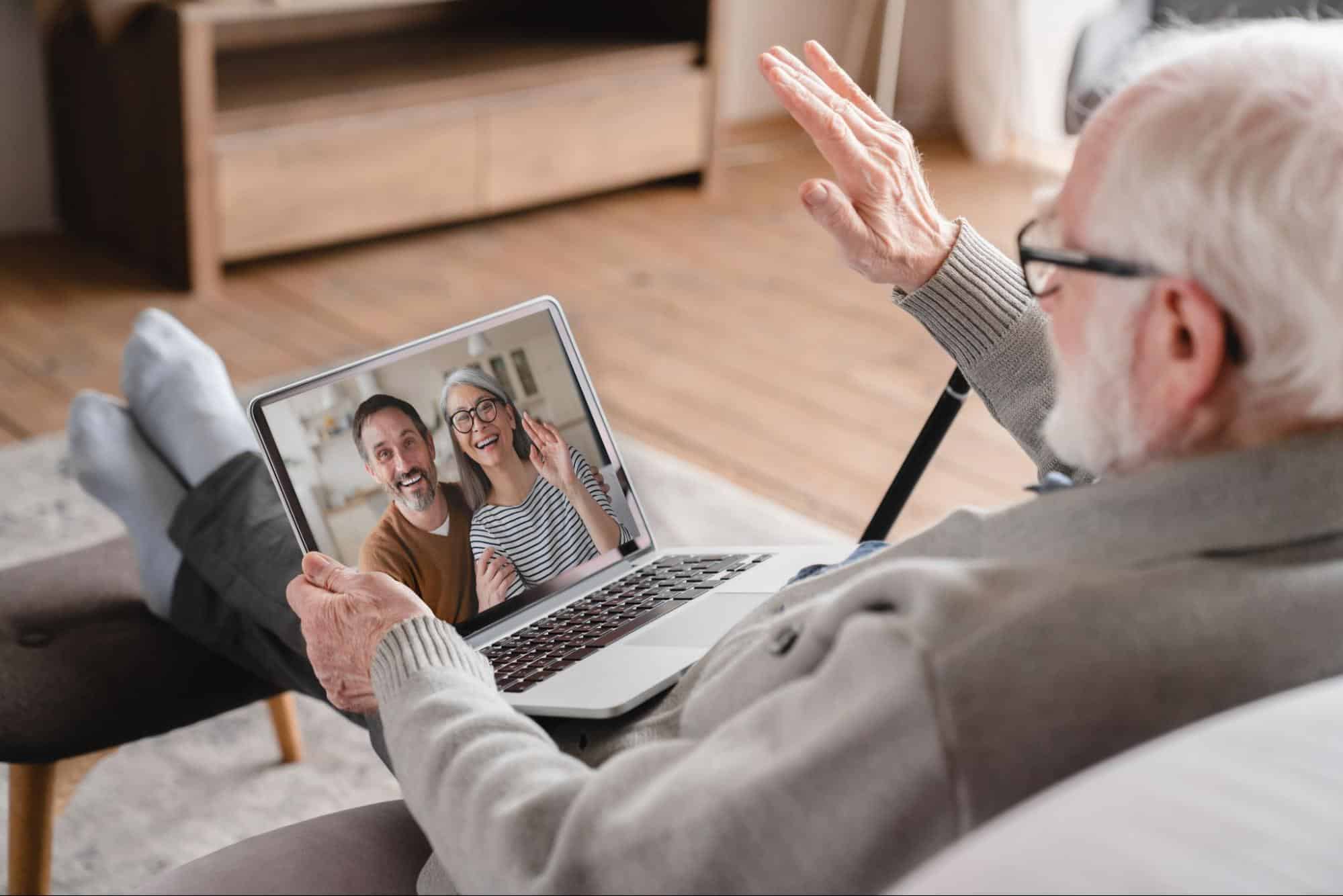 man-in-assisted-living-video-chatting-with-family