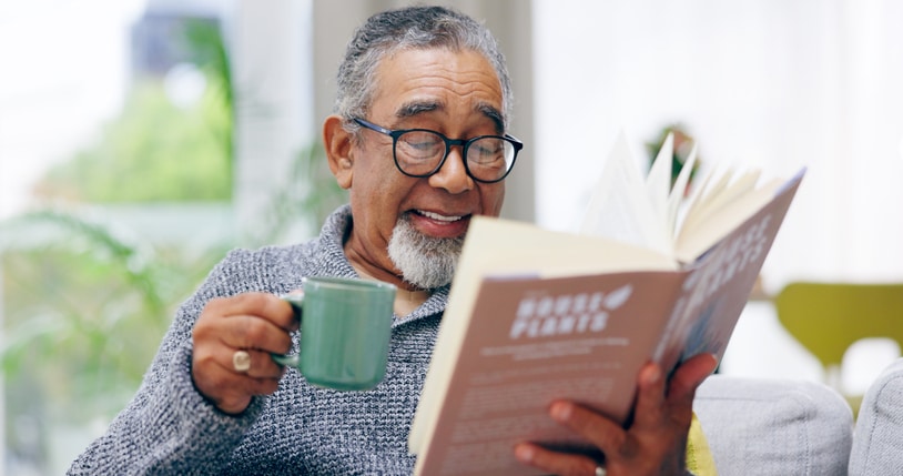 elderly man reading book