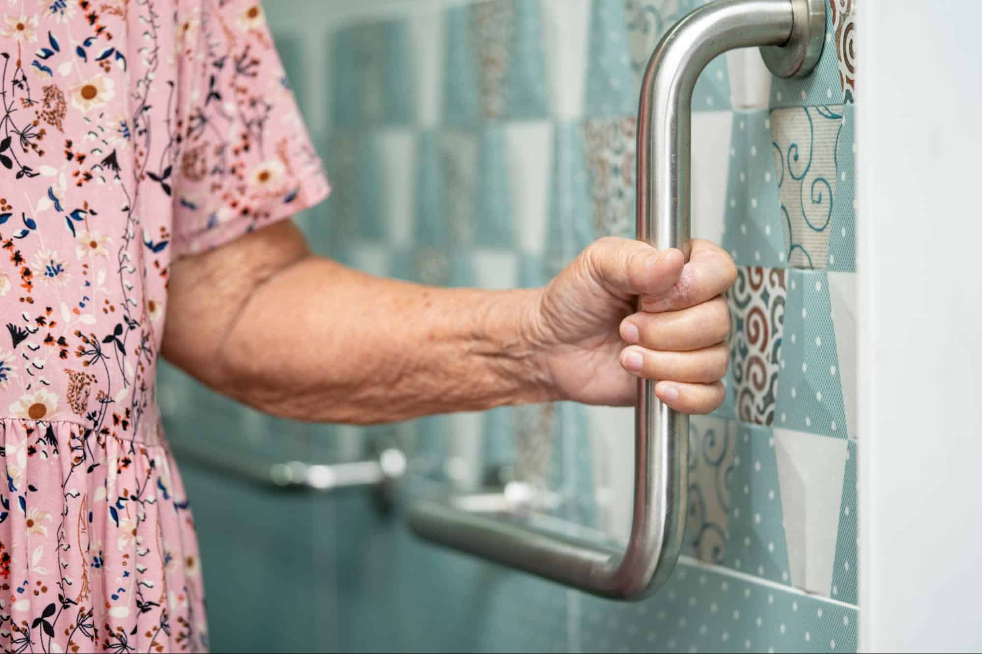 elderly-woman-holding-safety-bar